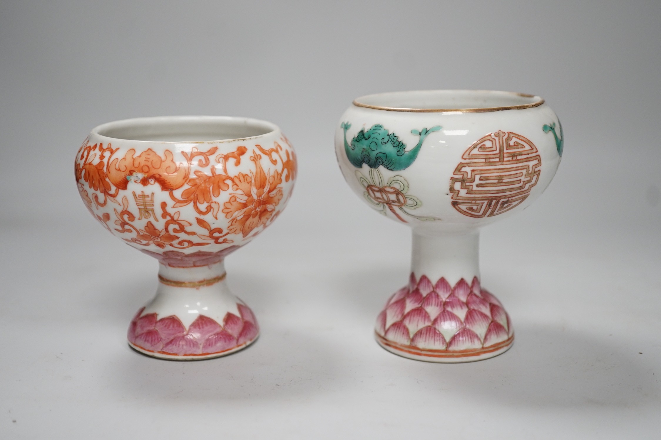 Two 19th century Chinese enamelled porcelain stem bowls, each painted with bats and Shou, the foot with Lotus petals, tallest 11cm